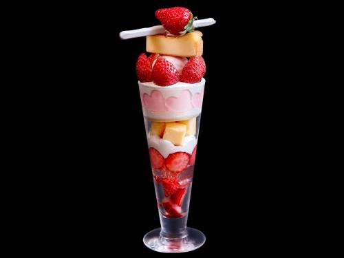 a glass cup filled with fruit and a strawberry at Hotel The Celestine Tokyo Shiba in Tokyo