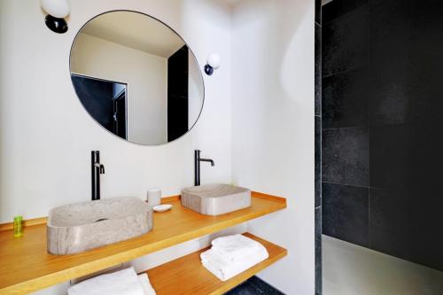 a bathroom with a sink and a mirror at Amazing apartments - Arc de Triomphe-Champs Elysée in Paris