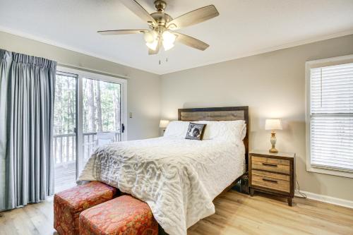 a bedroom with a bed and a ceiling fan at Modern McCormick Townhome on Lake Thurmond! in McCormick