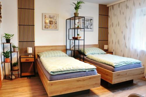 two twin beds in a room with at Apartment Andreas Bichler in Weistrach