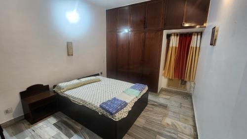 a small bedroom with a bed in a room at SDY home stay in Puducherry