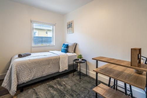 a bedroom with a bed and a window at 2 BD Home w/ Private Parking, Private Yard & W/D in Miami
