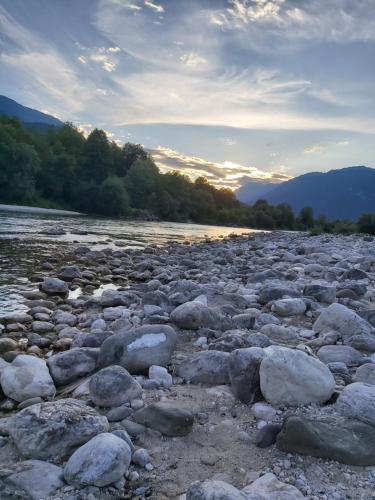 a large group of rocks on a river at Apartma Brešan in Kobarid
