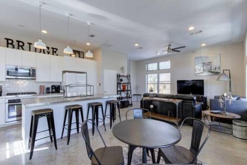 a kitchen with a table and chairs in a room at Bridge - A Birdy Vacation Rental in San Antonio