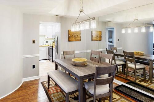 a kitchen and dining room with a table and chairs at Paradise Peak Retreat in Sugar Mountain