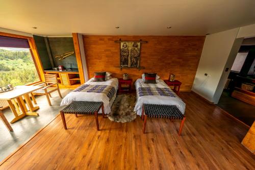Postel nebo postele na pokoji v ubytování NÓMADES Hotel Boutique