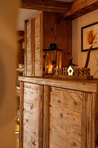 a wooden counter with a lantern on top of it at Chalet Bucher in Ehrwald