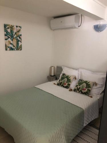 מיטה או מיטות בחדר ב-Chez Laurenn