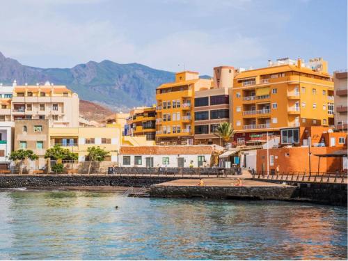 a group of buildings next to a body of water at Trip Puertito Pescadores in Puertito de Güímar