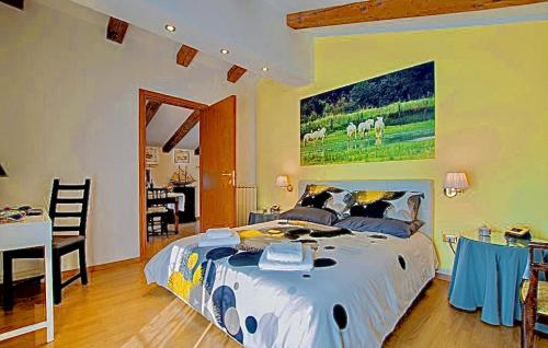 a bedroom with a bed and a table and a dining room at CA' LEONE - Sans Souci - Apartment with Pool in Mira