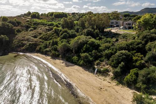an aerial view of a beach with a house at Luxury Villa Mon I Vassilikos in Vasilikos