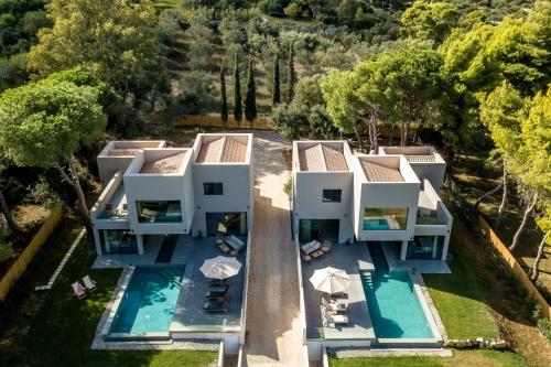 an aerial view of a house with a swimming pool at Luxury Villa Mon I Vassilikos in Vasilikos