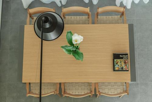 a wooden table with a flower on top of it at Luxury Villa Mon I Vassilikos in Vasilikos