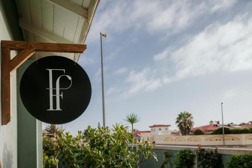 a sign on the side of a building at Fancy Fritz B&B in Swakopmund
