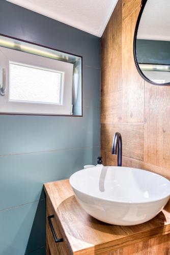 a bathroom with a white sink and a mirror at Miro guesthouse in Tivat