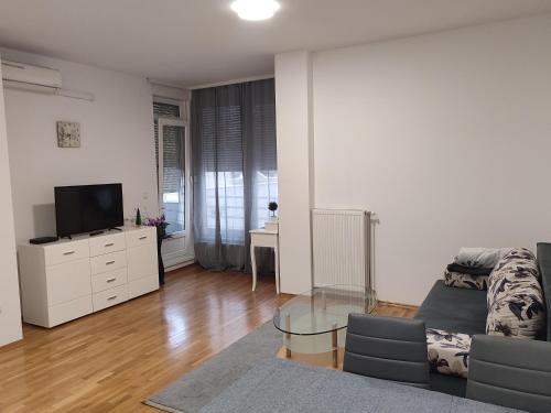 a living room with a couch and a tv at Kastel in Banja Luka