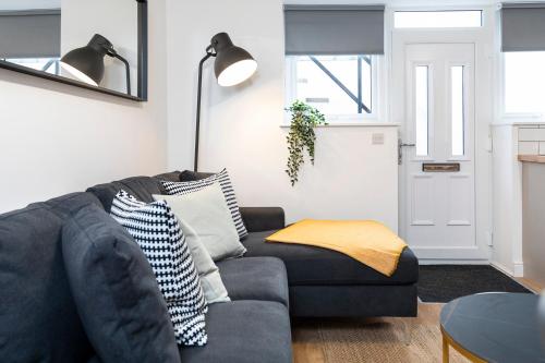 a living room with a couch and a table at Popular Two Bed Apt in Leeds City in Headingley