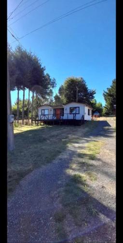 a couple of trailers parked in a field at CABAÑAS LOMAS DE YECO in Valdivia