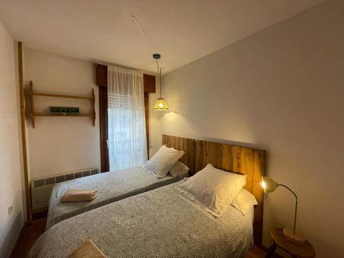 Postel nebo postele na pokoji v ubytování Apartamento Alba 2