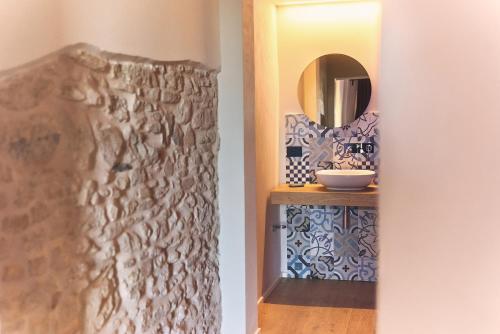 a bathroom with a mirror and a sink at URBAN PRIVATE SPA in Porto SantʼElpidio