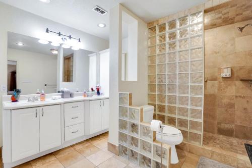 a bathroom with a shower and a toilet and a sink at Fortuitous - A Birdy Vacation Rental in San Antonio