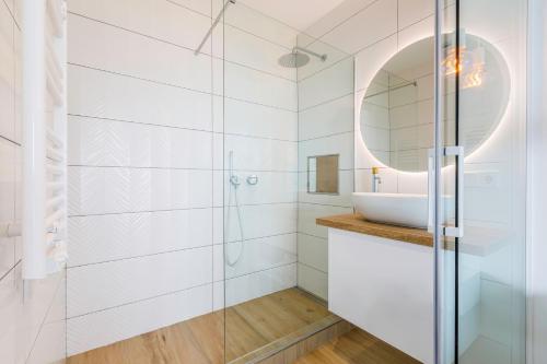 a bathroom with a glass shower and a sink at Cap Sa Sal Aquamarina Begur in Begur