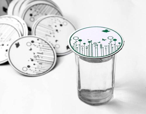 a glass vase with trees on it next to a sink at 2BHK AC Service Apartment 102 Bhugaon in Pune