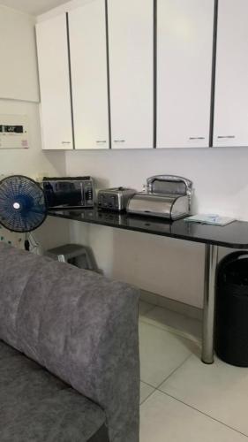 a kitchen with a counter top with two toasters on it at Toti Cabana 58 in Amanzimtoti