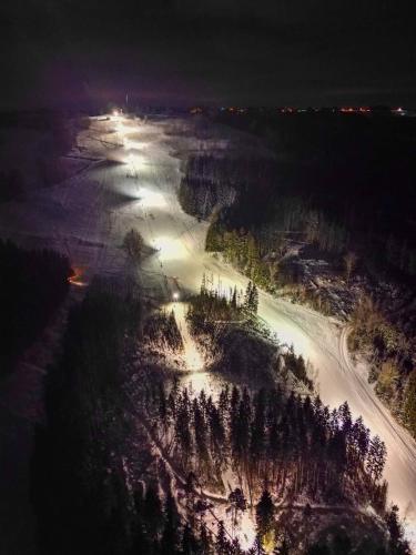 an aerial view of a snow covered road at night at Apartmán Vysoké nad Jizerou in Vysoké nad Jizerou