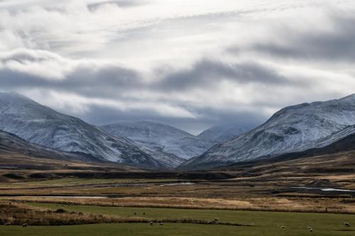 a view of a mountain range with snow covered mountains at Kornmúli in Búðardalur