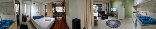 two views of a living room and a room with a bed at Cosy 2 bedroom unit with pool,Wifi in Suva