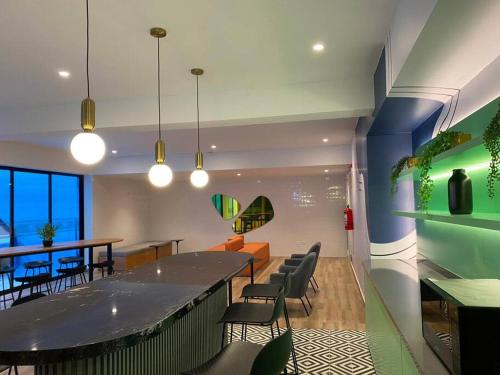 a dining room with a large table and chairs at Apartamento en Barranco in Lima