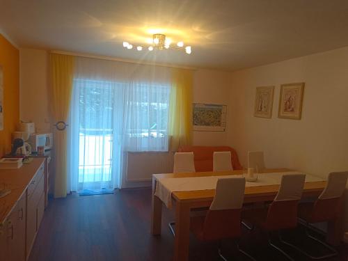 a dining room with a table and chairs and a window at Pension Eva in Domažlice