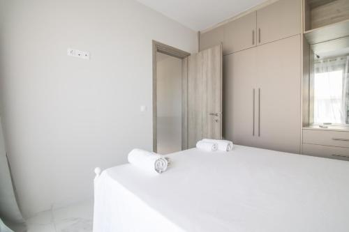 Ένα ή περισσότερα κρεβάτια σε δωμάτιο στο G Quattro Luxury Apartments