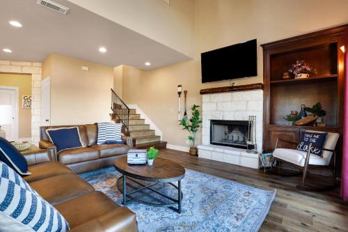 a living room with a couch and a fireplace at Lake House - A Birdy Vacation Rental in Canyon Lake
