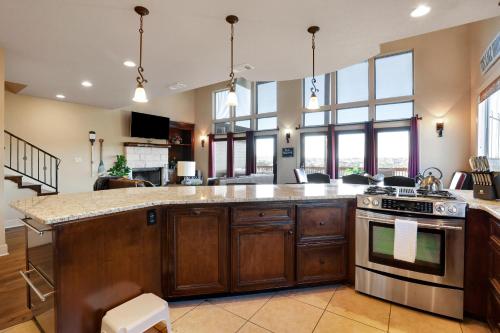 a kitchen with a stove and a counter top at Lake House - A Birdy Vacation Rental in Canyon Lake