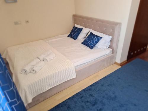 a bedroom with two beds with towels on them at Apart Hotel Sutoris in Bochnia