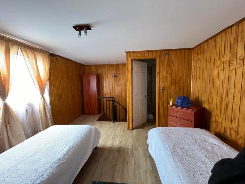 Cama o camas de una habitación en Cabañas Cisne Cuello Negro