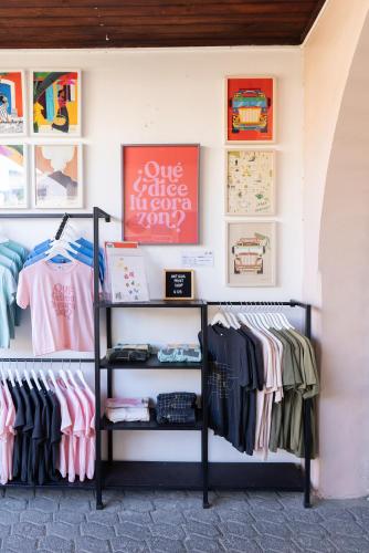a clothing store with racks of clothes on display at Maya Papaya in Antigua Guatemala