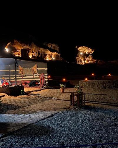 a painting of a cow on a wall at night at Desert Island Camp in Aqaba