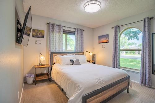 a bedroom with a large bed and a window at Montage - A Birdy Vacation Rental in Schertz