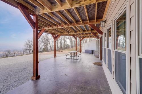a pavilion with a table on the side of a building at Spacious Harrison Vacation Rental with Deck and Views! in Harrison