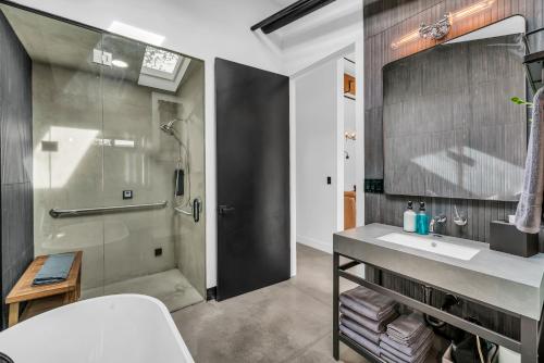 a bathroom with a shower and a sink at Canyon Casitas at Zion in Springdale