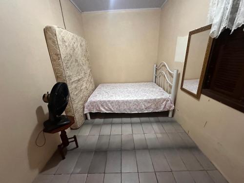 Кровать или кровати в номере Casa albatroz Imbé