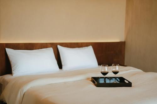 Postel nebo postele na pokoji v ubytování Equ Hotel Boutique
