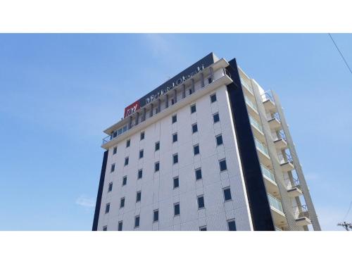 a tall building with a sign on top of it at My Hotel Okazaki - Vacation STAY 40799v in Okazaki