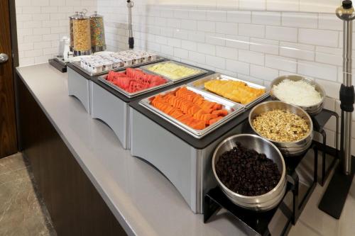 a buffet line with many different types of food at Holiday Inn Express & Suites Monterrey Valle by IHG in Monterrey