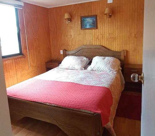Cama ou camas em um quarto em Apartamentos Cadiz -Valdivia