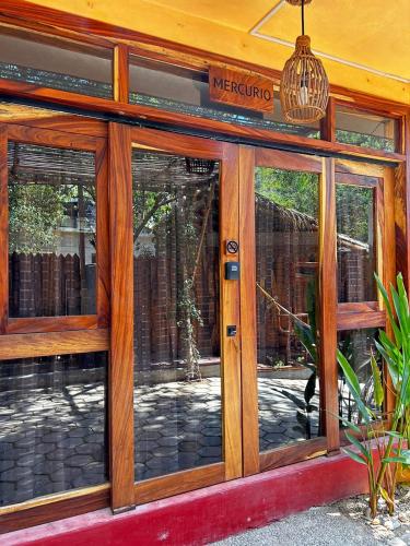 a store front with glass doors and a sign at Casa AVA in Mazunte