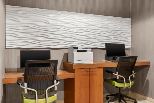 an office with a desk with two chairs and a projector at SpringHill Suites by Marriott Chicago Bolingbrook in Bolingbrook